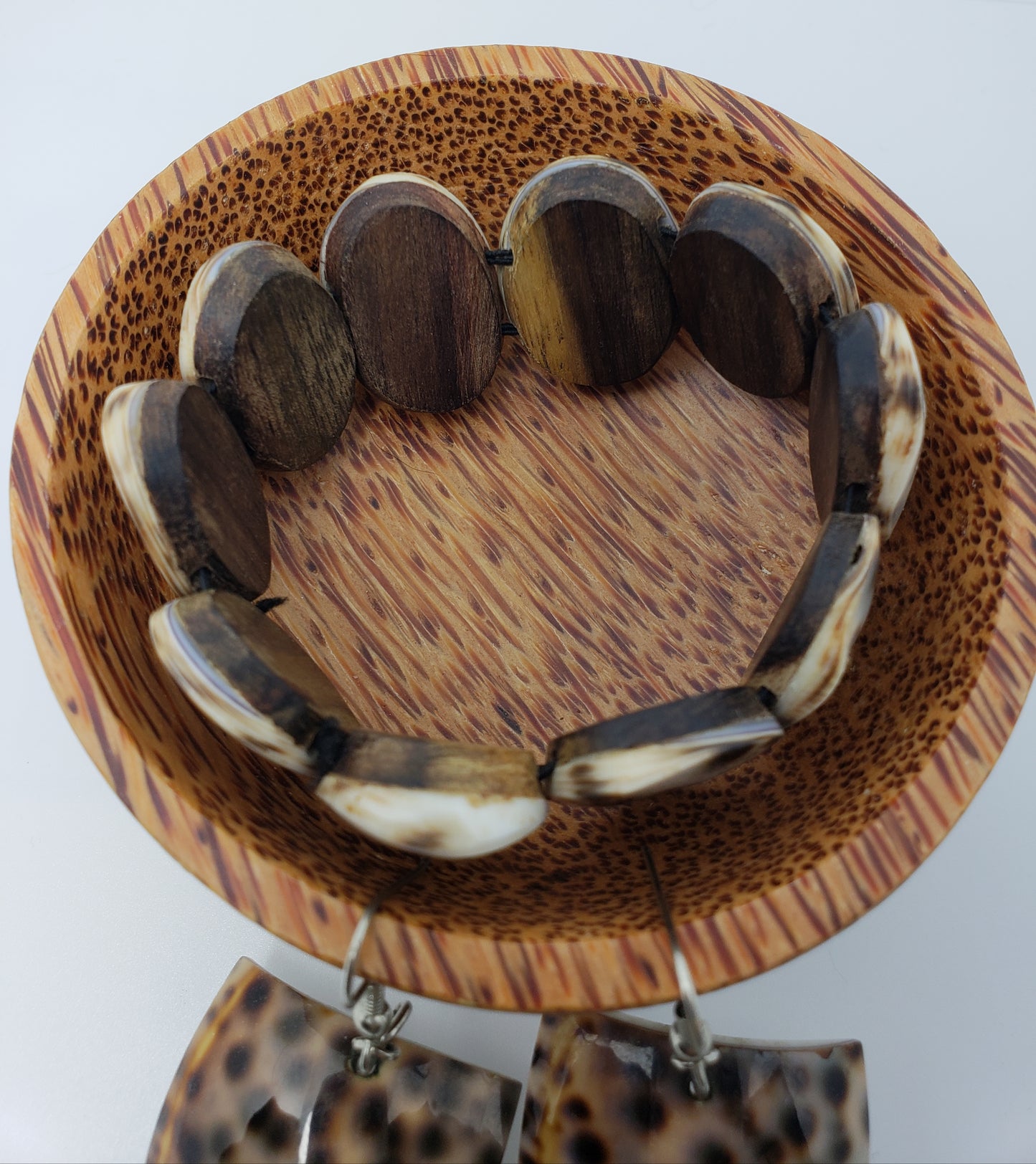 Shell earring and bracelet jewelry set.