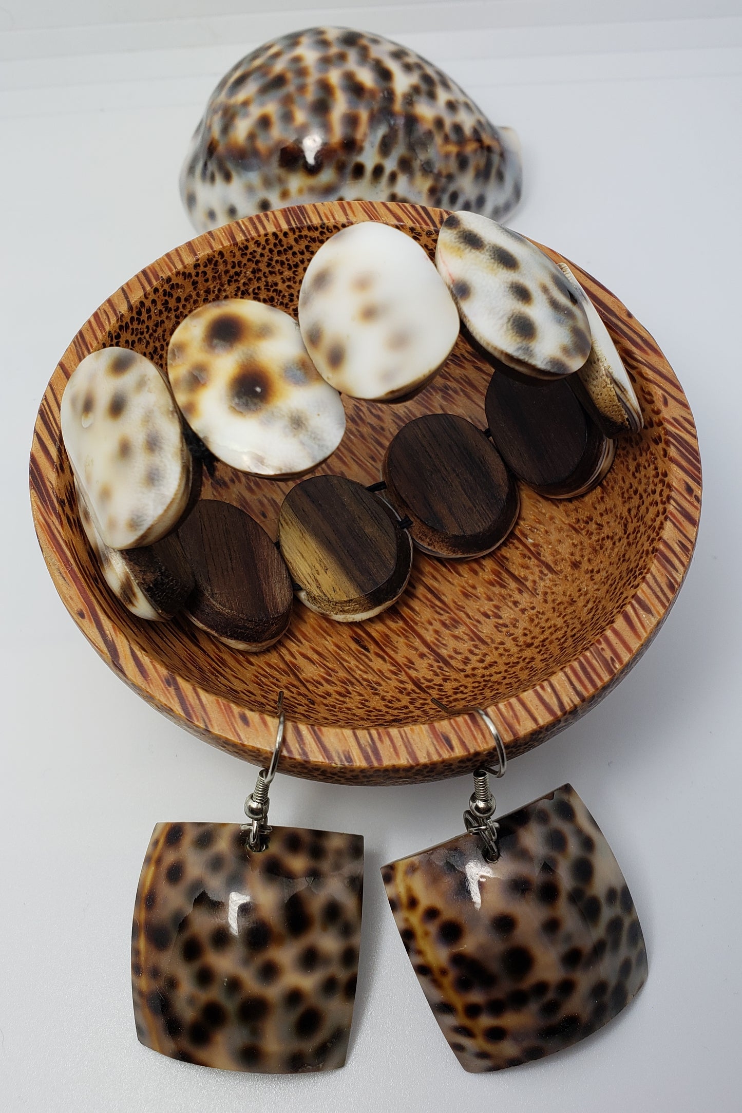 Shell earring and bracelet jewelry set.